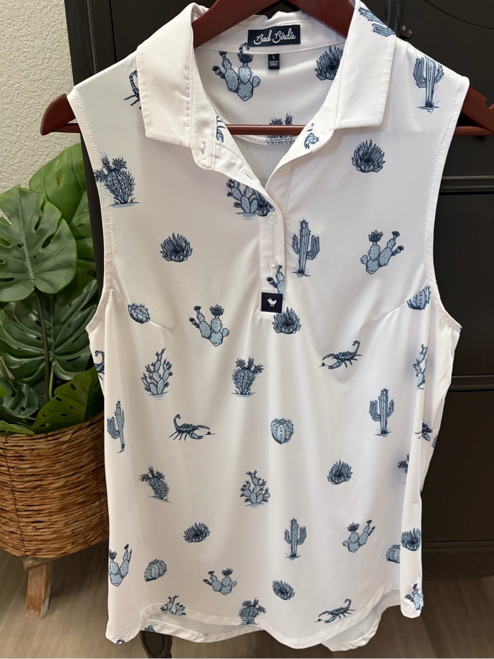 Bad Birdie Women’s White Sleeveless Golf Polo with Blue Desert Print Large